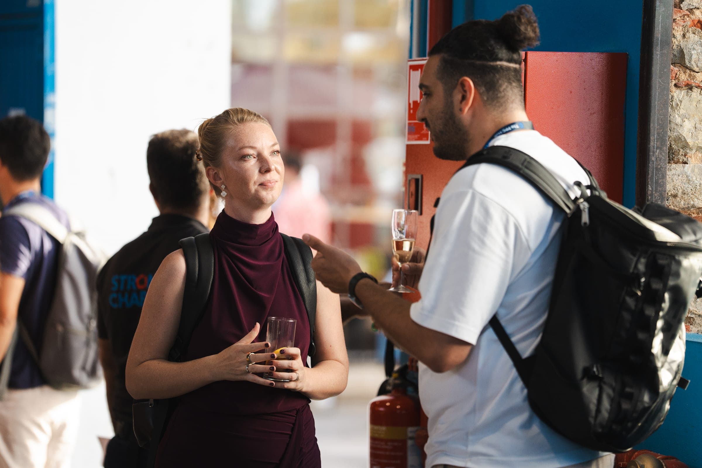 Attendees in conversation over drinks at the reception