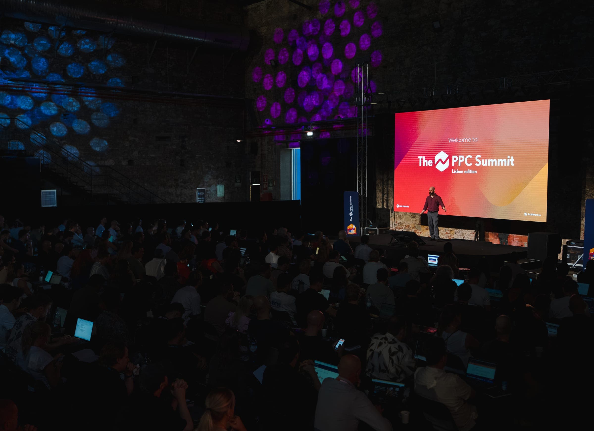 The main stage at LX Factory with "Welcome to The PPC Summit" on the screen, Lisbon 2026